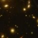 Imagen del telescopio James Webb donde puede distinguirse el objeto Earendel (como un punto situado sobre un arco de color rojizo, en la parte derecha de la imagen), que parece ser la estrella más distante jamás observada. [NASA/ESA/CSA/STScI]